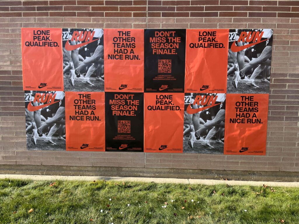 Posters on brick wall promoting sports event.