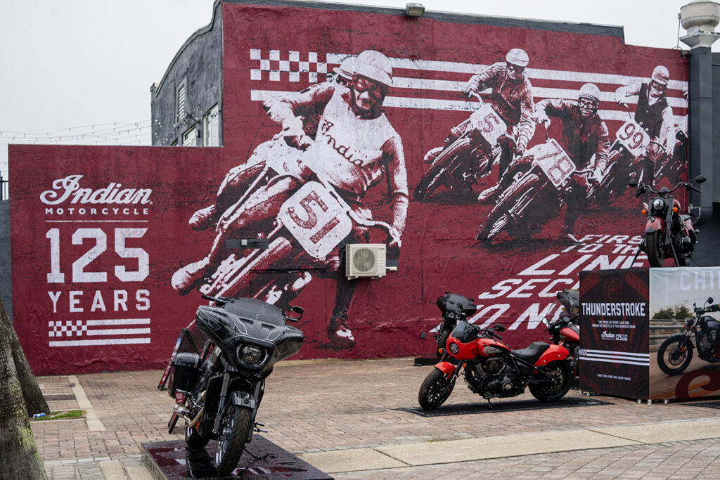 AGM large-format painted mural brand activation for Indian Motorcycle 125th anniversary warehouse arts district street marketing Philadelphia Dallas Houston World Cup 2026