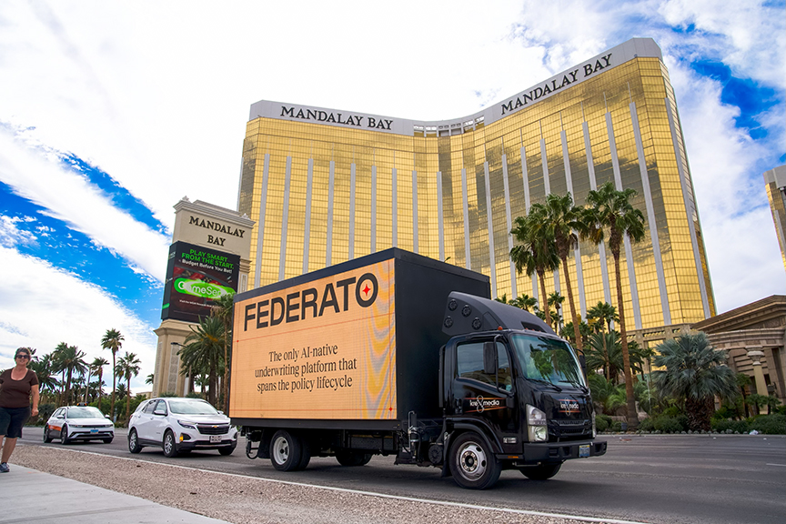 Federato 14ft LED billboard truck displaying AI-native underwriting platform messaging in front of the Mandalay Bay hotel on the Las Vegas Strip.