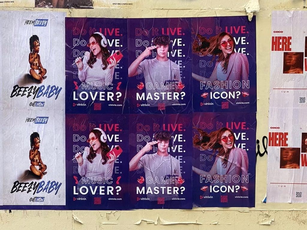 Posters promoting a music, gaming, and fashion event featuring diverse individuals, with text asking "Do it LIVE. LOVE. GAME?" and "MUSIC LOVER?" "GAME MASTER?" "FASHION ICON?" in a vibrant urban setting, relevant to guerrilla marketing strategies for bars and restaurants.