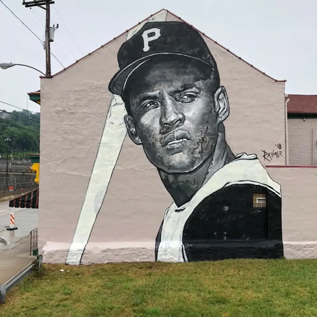 Mural of a baseball player wearing a cap with "P," showcasing street art related to urban marketing and guerrilla advertising strategies.