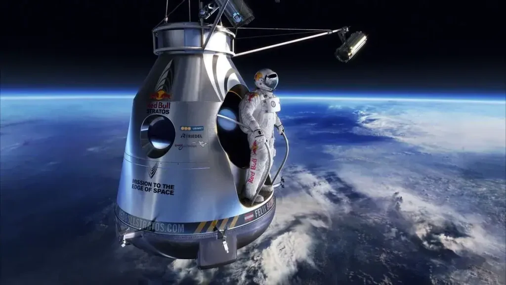 Astronaut in space near Earth, showcasing Red Bull Stratos mission spacecraft, emphasizing innovative marketing and brand activation in extreme environments.