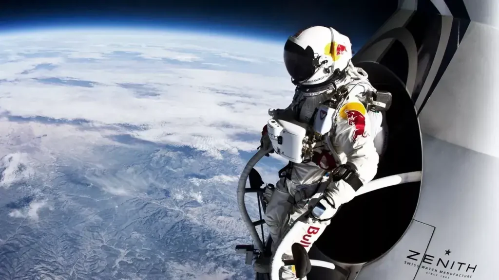 Astronaut in a space suit with Red Bull branding preparing to jump from a spacecraft, overlooking Earth from the edge of space, symbolizing innovative marketing and extreme brand visibility.