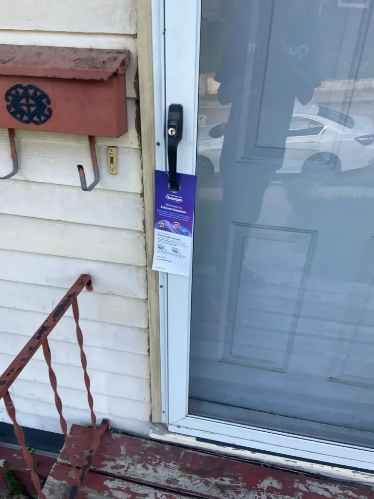 Door hanger promotion displayed on a residential front door, showcasing hyperlocal marketing strategy by American Guerrilla Marketing.