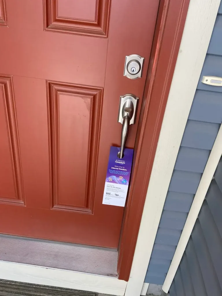 Door hanger marketing material displayed on a residential door, showcasing hyperlocal promotional strategies for American Guerrilla Marketing.
