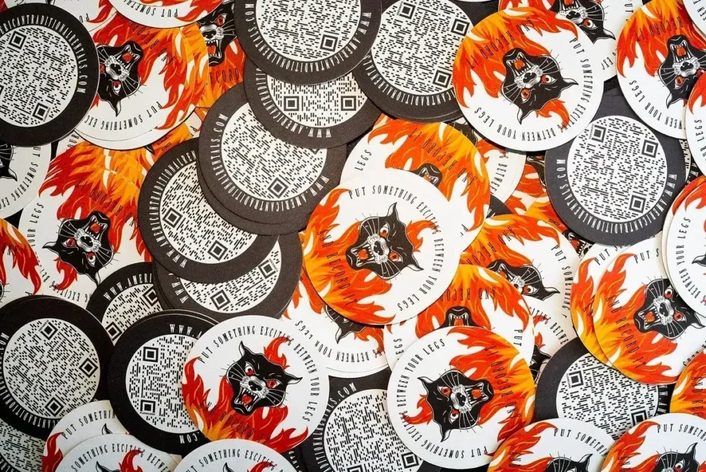 Branded beer coasters featuring a black panther graphic and QR codes, designed for bar and restaurant advertising in hyperlocal marketing campaigns.