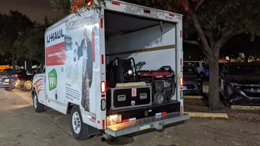 U-Haul truck parked at night with visible equipment inside, representing mobile marketing solutions for guerrilla advertising strategies.