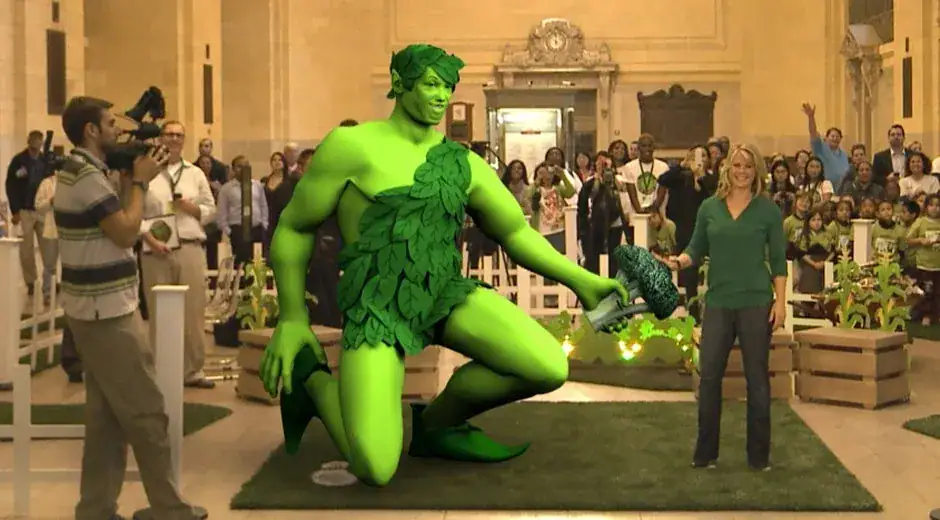 AR event featuring a large green character surrounded by an audience, showcasing innovative marketing strategies.