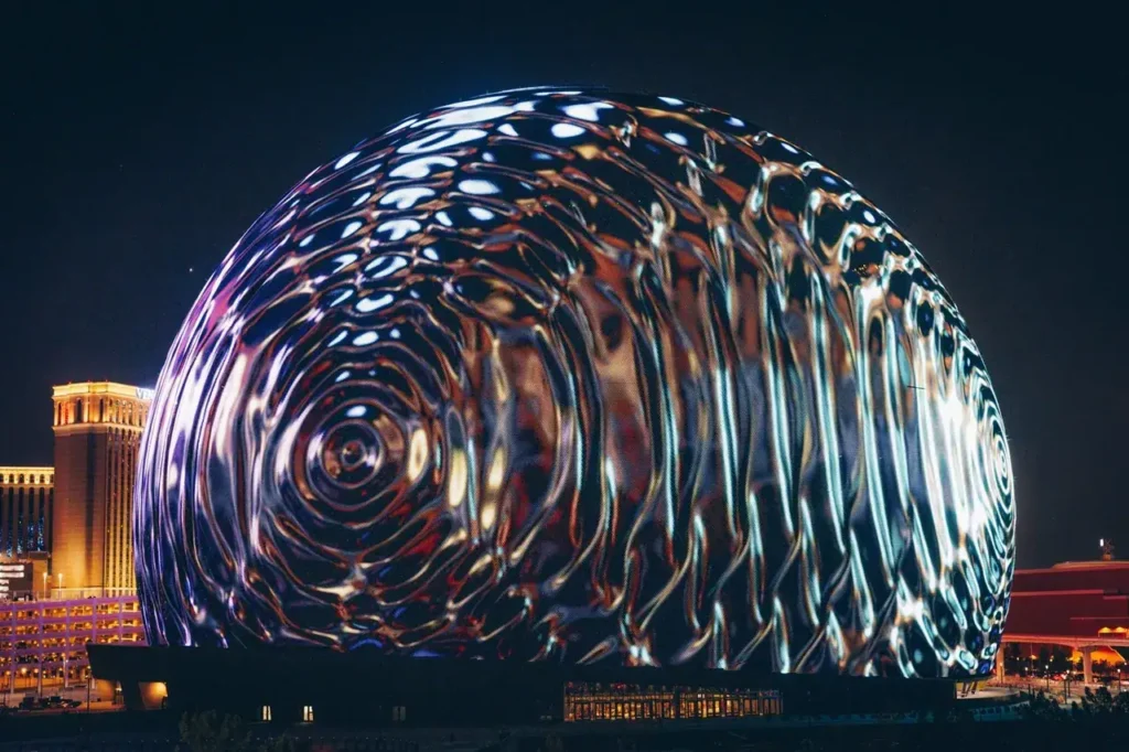 Las Vegas Sphere illuminated at night, showcasing dynamic visual patterns, representing innovative advertising opportunities in modern marketing strategies.