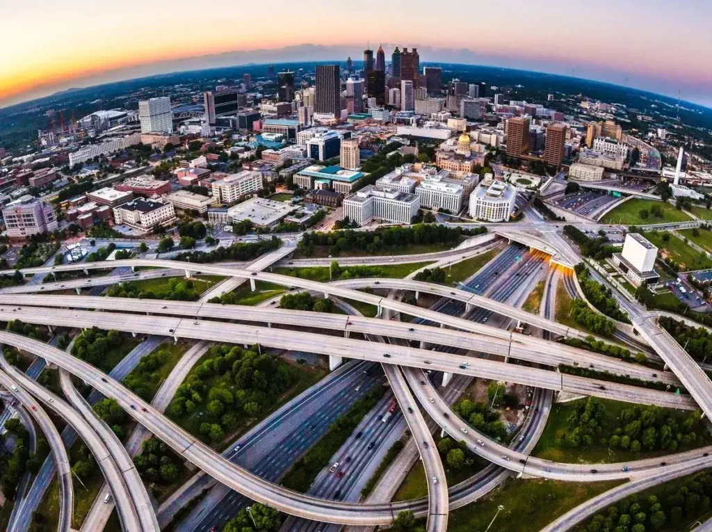 Aerial view of downtown Atlanta, Georgia, showcasing highways, urban landscape, and skyline, relevant to billboard advertising strategies and marketing insights.
