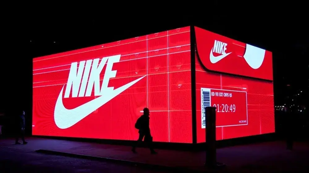 LED billboard featuring Nike branding and countdown timer, showcasing innovative advertising strategies in urban settings.