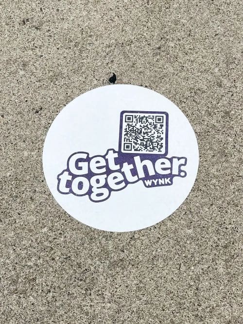 Get Together WYNK sidewalk stencil with QR code, promoting innovative outdoor marketing strategies.