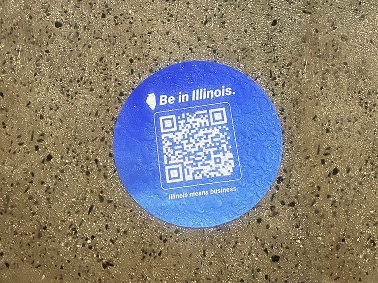A Sidewalk Decal Campaign for Intersect Illinois by American Guerrilla Marketing with decals on walkways near business and expo centers