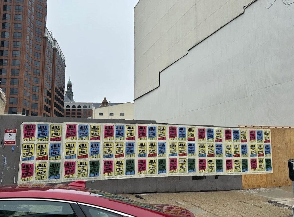 Political Wild Wheat Paste Marketing Ads by American Guerrilla Marketing posted in public areas to drive awareness and engagement