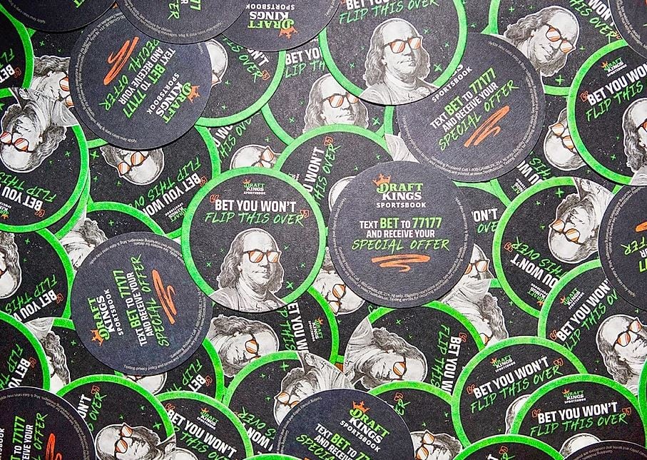 Poker chips with promotional text and images.