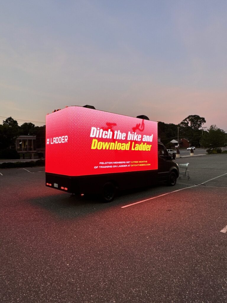 Truck with bright red advertisement display.
