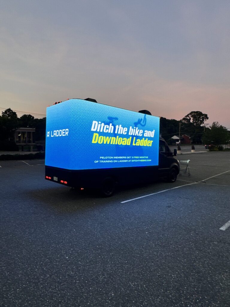 Truck with bright digital advertisement display.