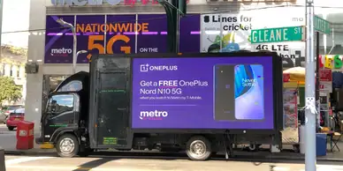 LED billboard truck advertising OnePlus Nord N10 5G, showcasing vibrant visuals and promotional text, positioned in an urban setting, emphasizing guerrilla marketing strategy by American Guerrilla Marketing.