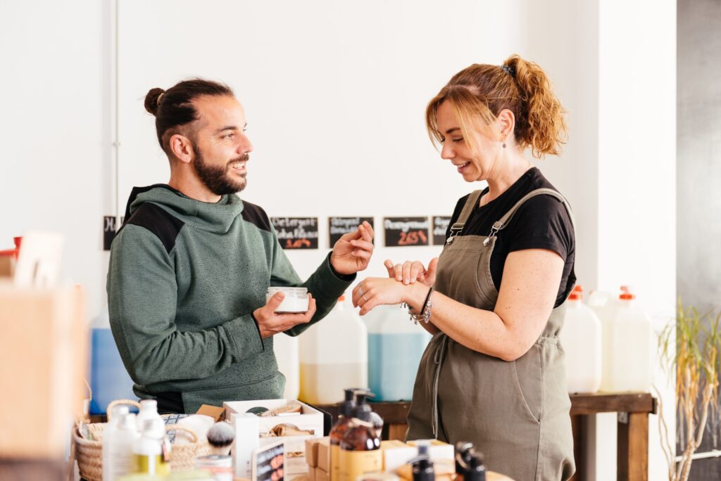 Man and woman discussing products in store.