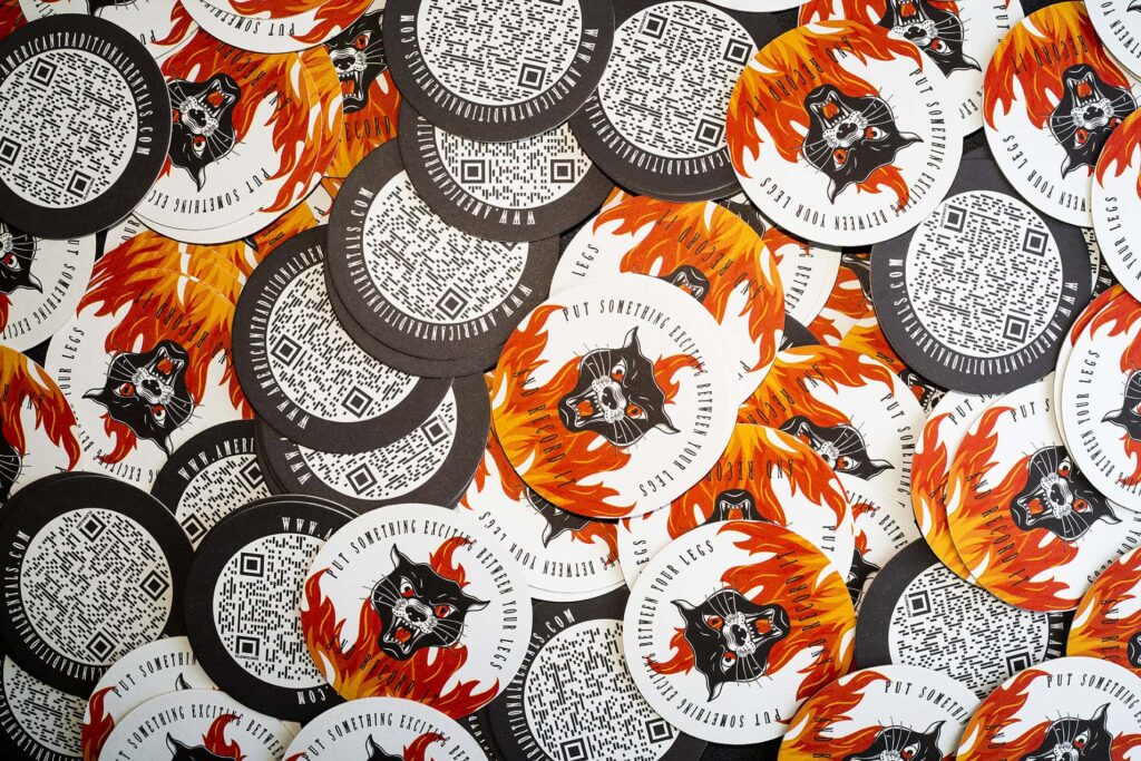 QR code stickers with fiery wolf design.