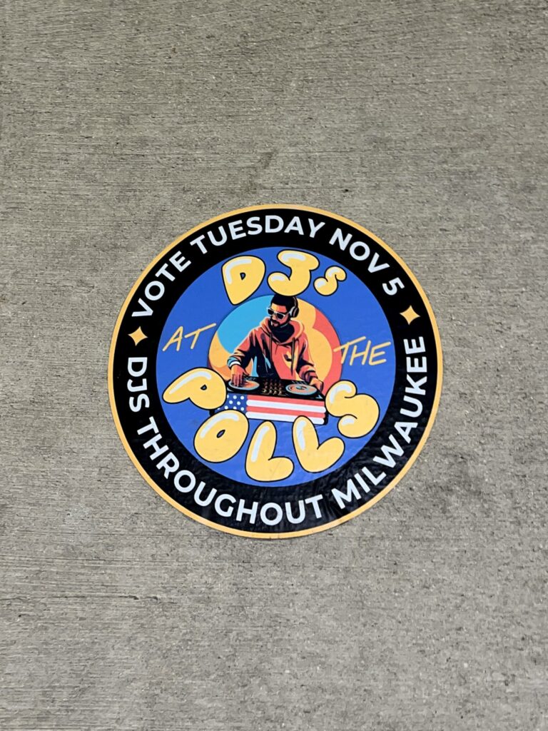 Vote Tuesday sticker promoting DJs at polls.