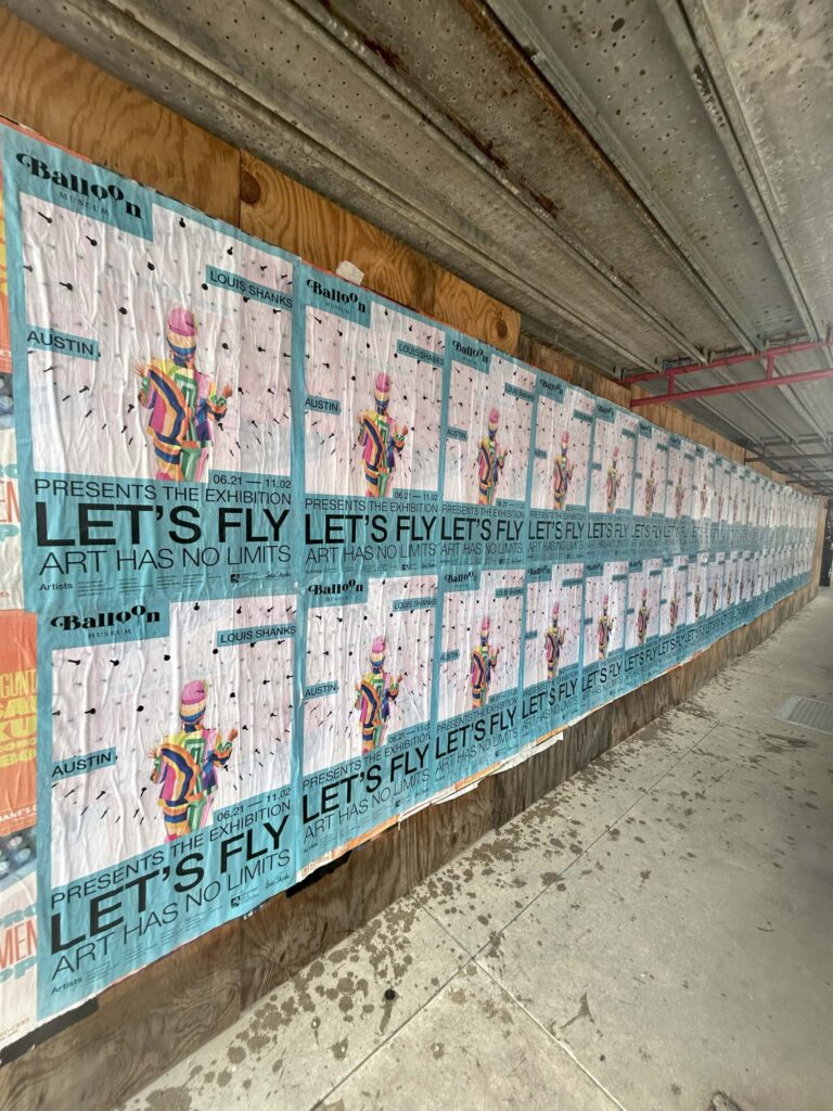 Posters on a wall under construction site.