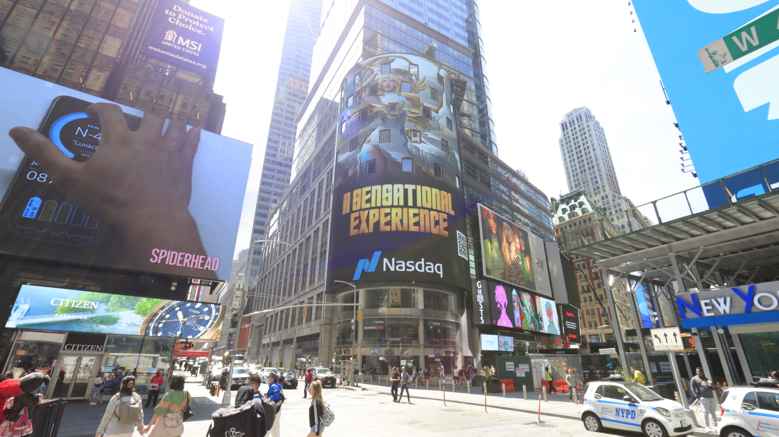 Billboard advertising for Nasdaq featuring "Destination Experience" in Times Square, Manhattan, with surrounding urban activity and digital displays.