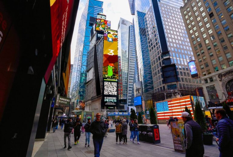 Times Square billboard displaying Diamond Peeps branding, featuring vibrant animations, QR code, and surrounding urban crowd engagement.
