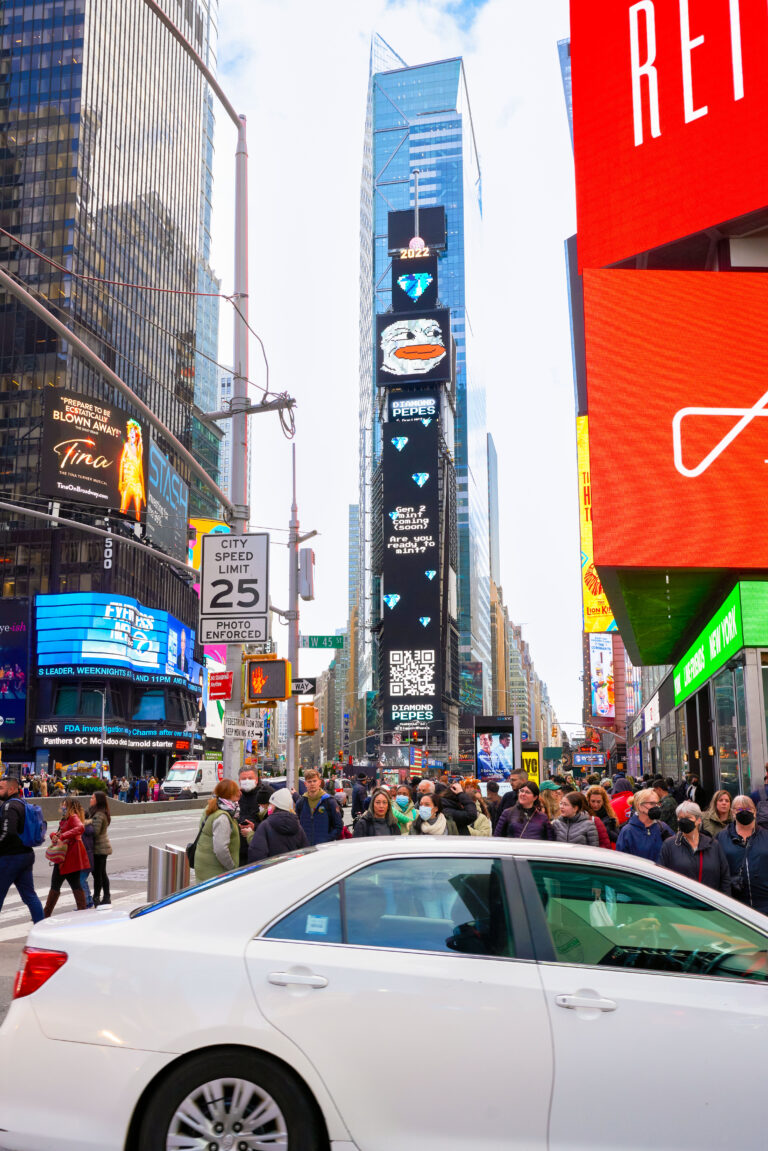 Times Square billboard displaying Diamond Peeps advertisement, surrounded by a bustling crowd and bright digital screens, highlighting high-traffic visibility for American Guerrilla Marketing's campaign.