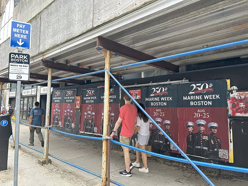 Posters for Marine Week Boston on sidewalk.