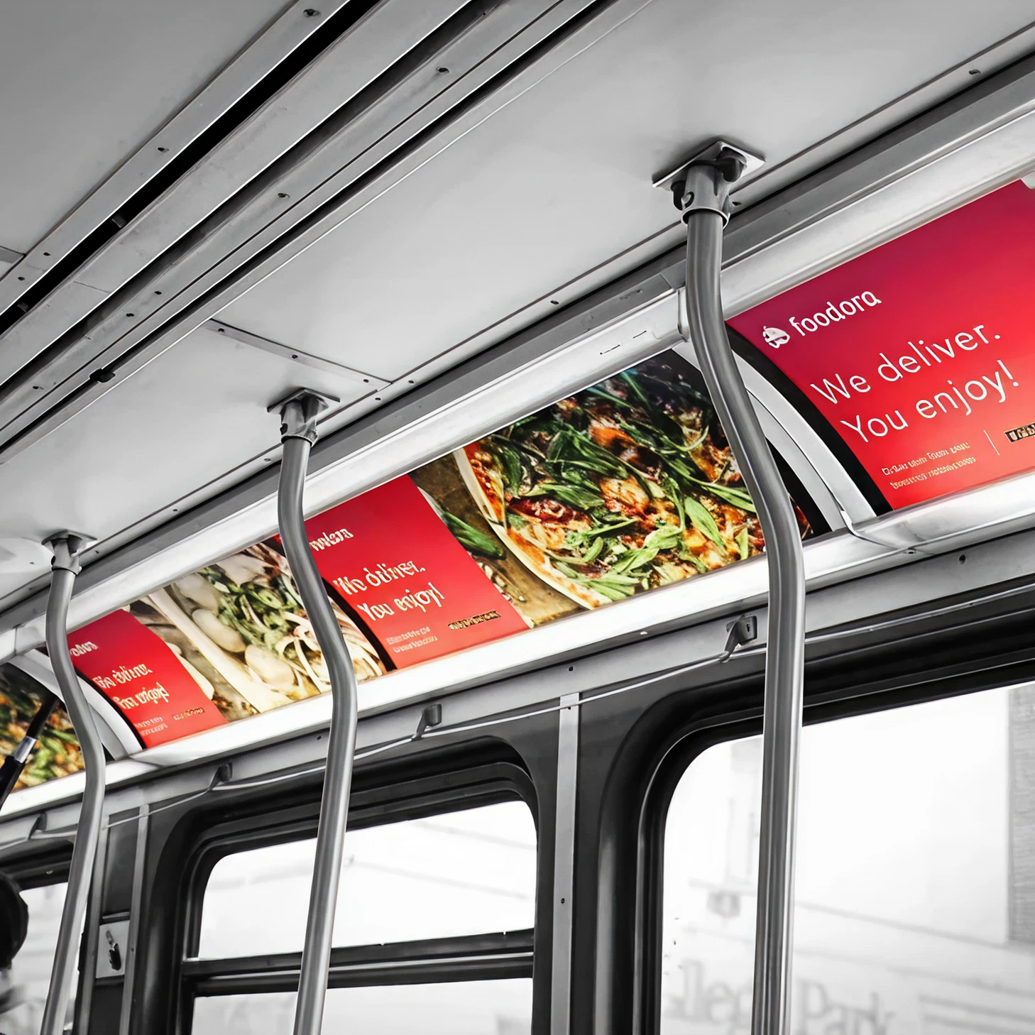 Interior of a bus featuring vibrant food delivery advertisements with the slogan "We deliver. You enjoy!" and colorful food images, emphasizing transit advertising strategies in Maine.