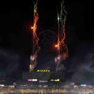 Fireworks display above Mizzou stadium during an event, enhancing the atmosphere of celebration and excitement.