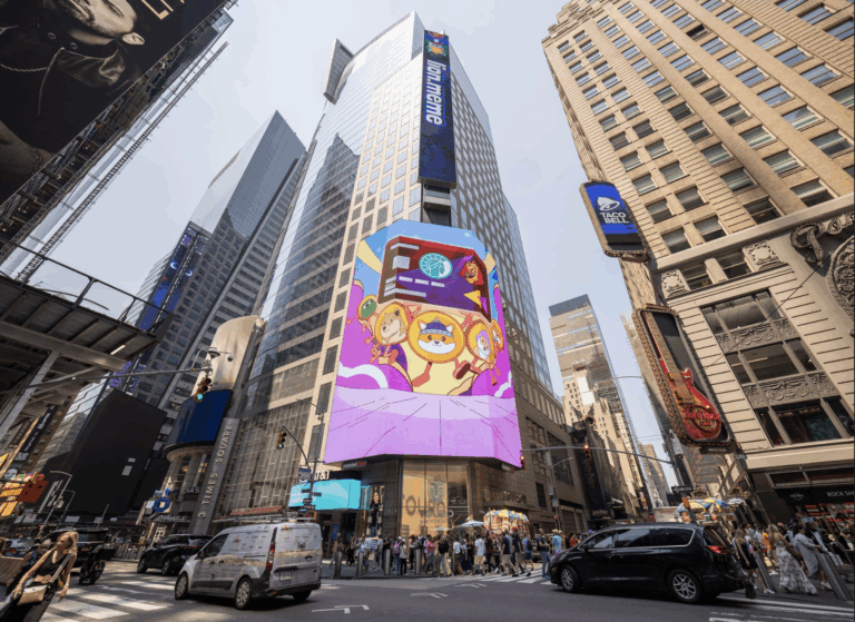 Large digital billboard in Times Square displaying colorful animated characters, surrounded by bustling city street with pedestrians and vehicles, exemplifying immersive brand activation in experiential marketing.