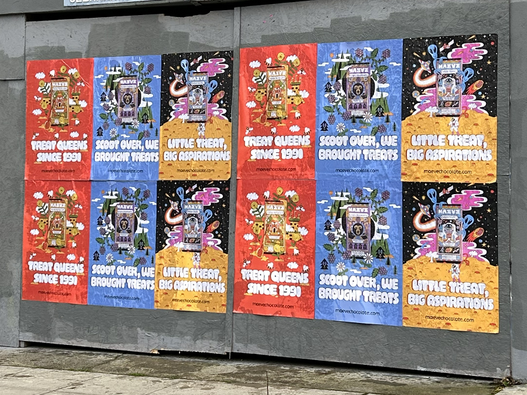Colorful street posters promoting Seattle Chocolate Co. with slogans like "Treat Queens Since 1991" and "Little Treat, Big Aspirations," showcasing vibrant graphics and playful designs.