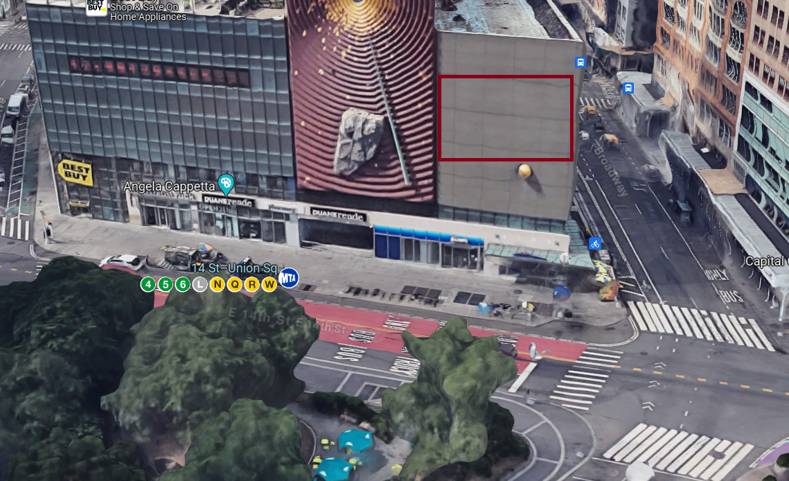 Aerial view of a building wall suitable for guerrilla projection advertising, featuring a blank section highlighted in red, located at 14th Street and Broadway in Union Square, New York.