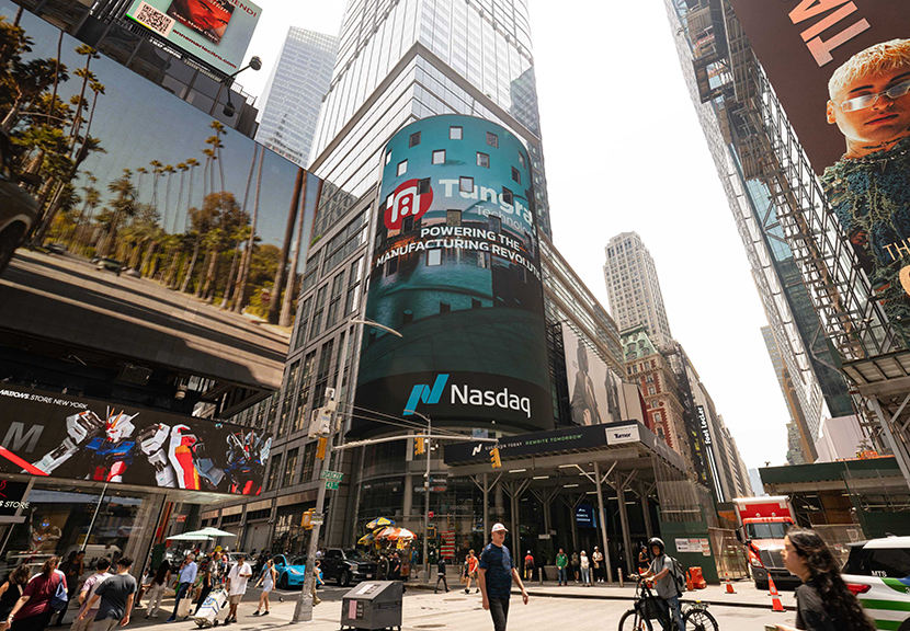 Times Square billboard featuring TungRay Technologies and Nasdaq branding, showcasing digital advertising in a bustling urban setting.