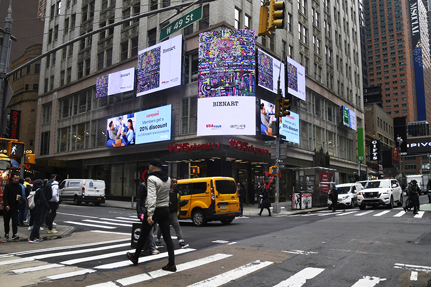 Times Square digital billboards displaying vibrant advertisements, including a visual art display by Bienart, alongside promotional content for various brands and services in a bustling urban setting.