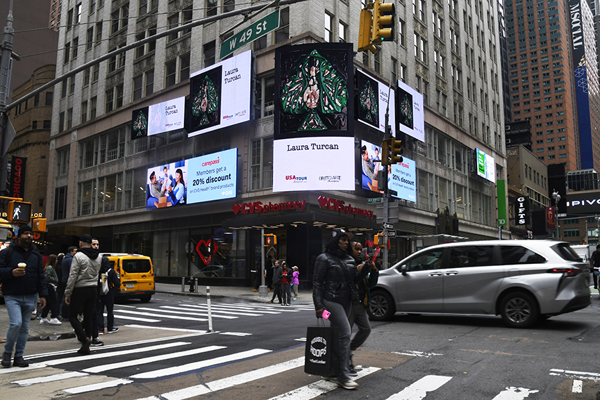 Times Square digital billboards displaying Laura Turcan's visual art alongside promotional advertisements, featuring pedestrians and vehicles on a busy New York City street.