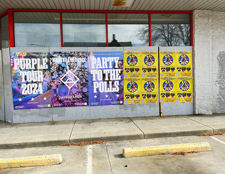 Wheatpaste posters for Daybreaker&rsquo;s Purple Tour 2024 and Party to the Polls campaign, showcasing vibrant designs in an urban setting.