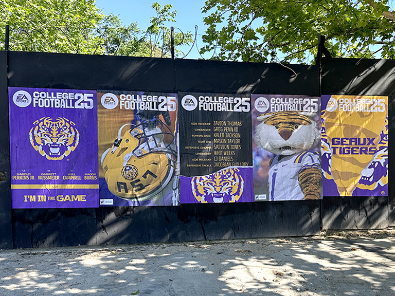 EA Sports College Football 25 wheatpaste poster campaign featuring LSU branding, including player images and team mascot, displayed in an urban setting.