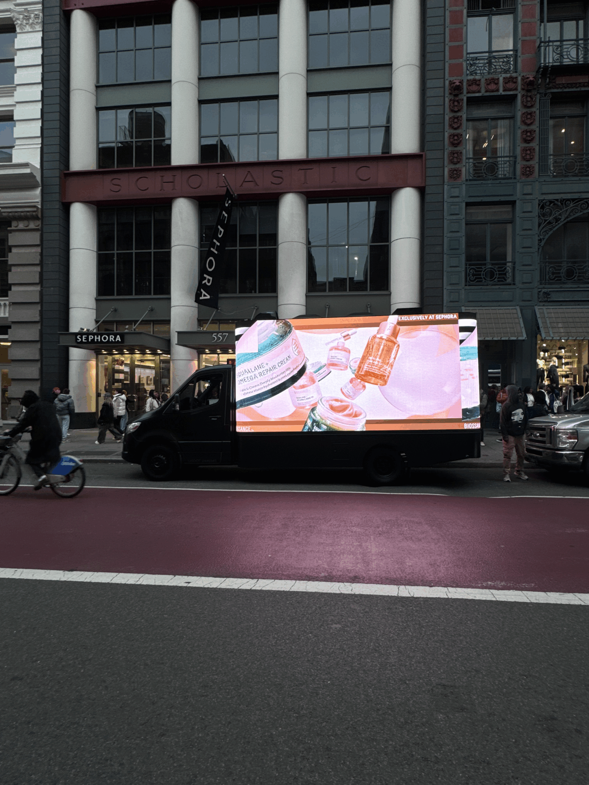 Seamless 3D LED billboard truck featuring Biossance skincare products outside Sephora in New York City, part of the "Illuminate Your World" guerrilla marketing campaign.