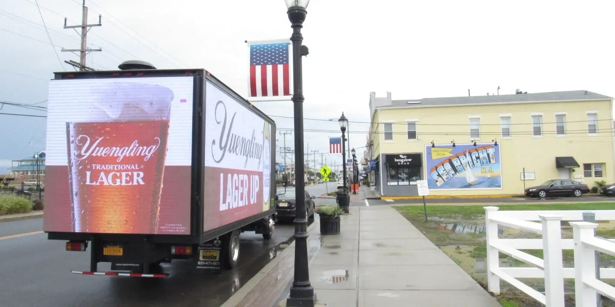 LED billboard truck displaying Yuengling Lager advertisement on a street in Ohio, showcasing dynamic advertising capabilities.