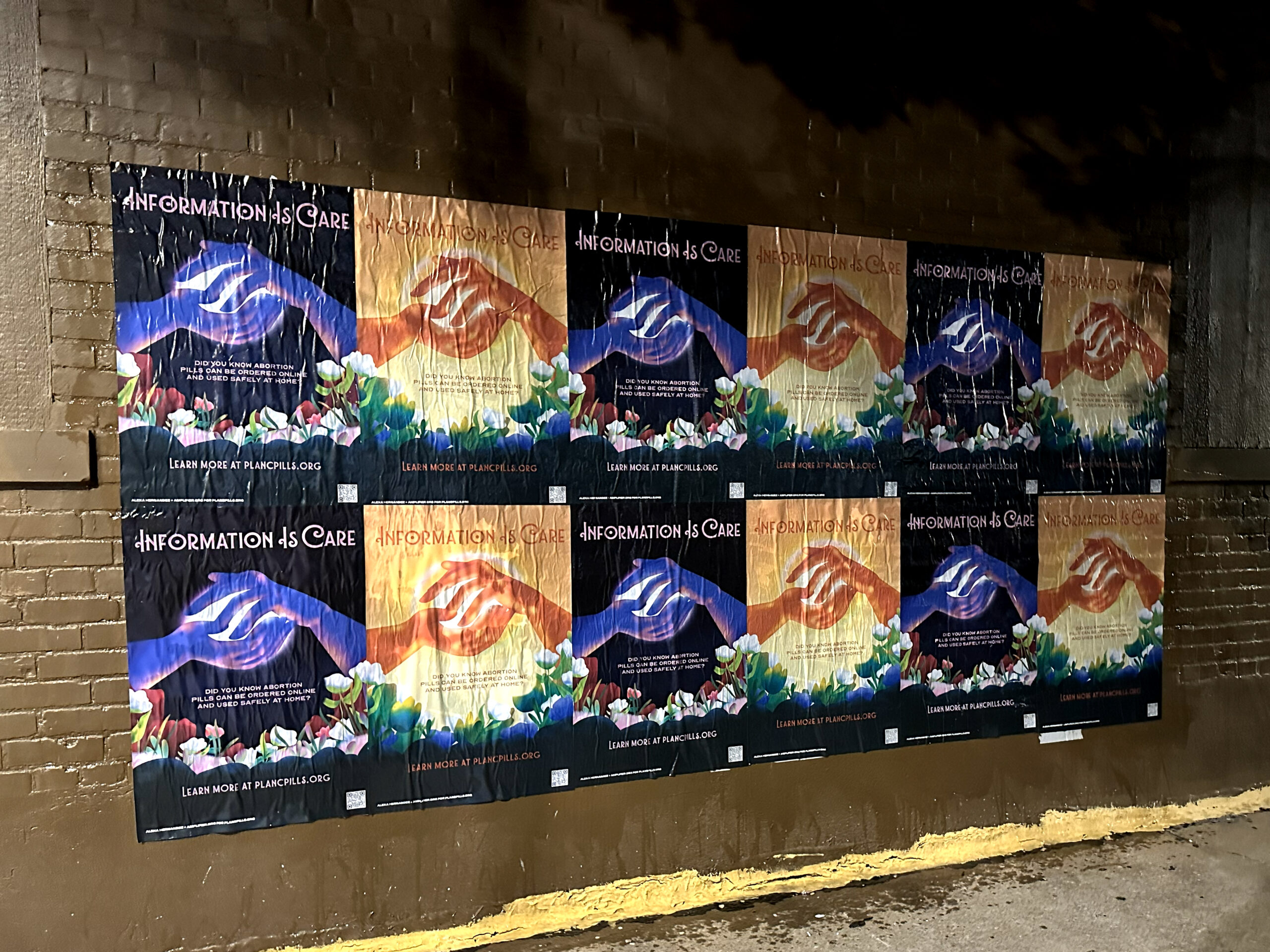 Wall covered with posters promoting the message "Information is Care," featuring hands and floral designs, supporting purpose-driven marketing and community engagement initiatives.