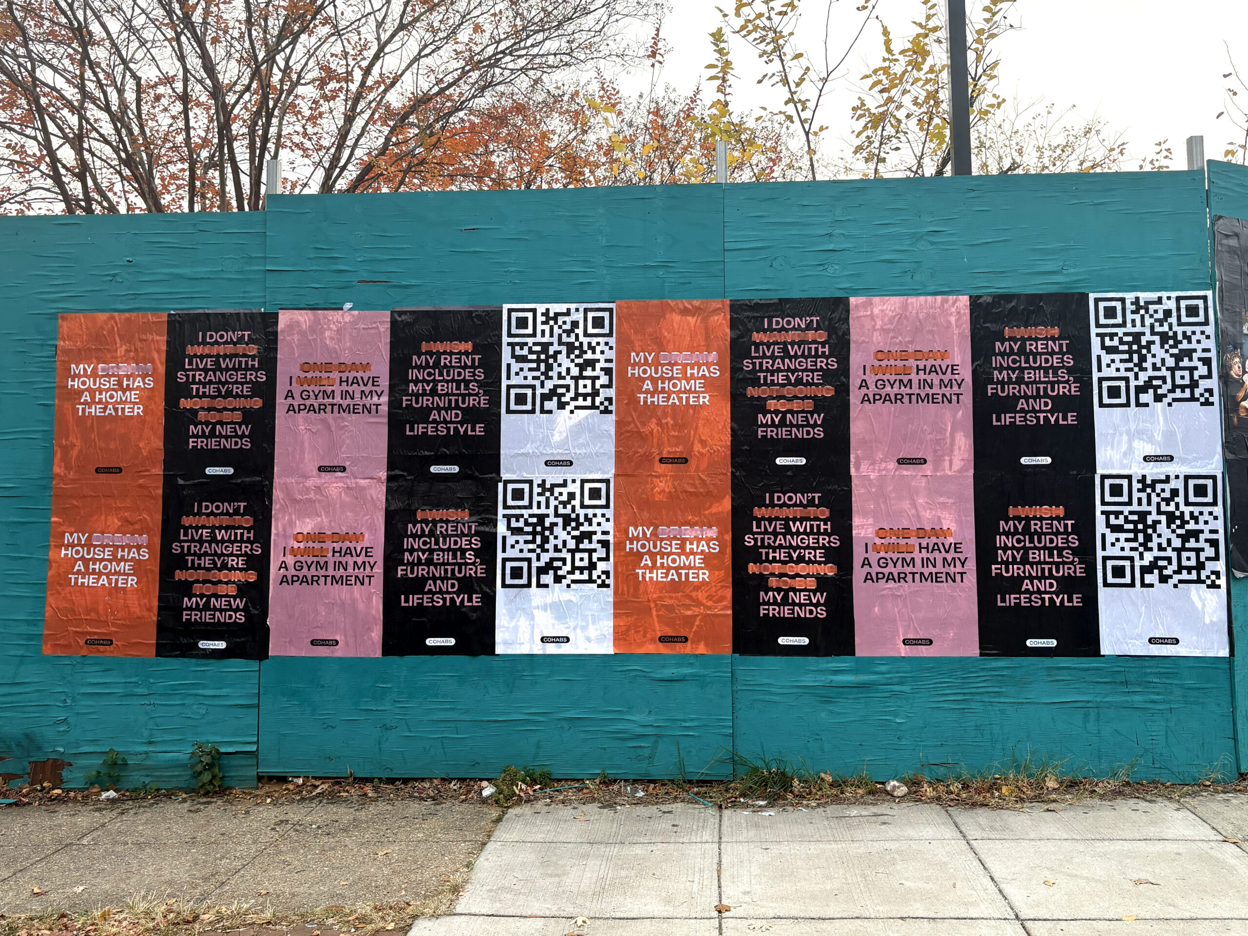 Colorful wall mural featuring various posters with text about lifestyle aspirations, QR codes, and personal living situations, illustrating guerrilla marketing for purpose-driven brand activism campaigns.